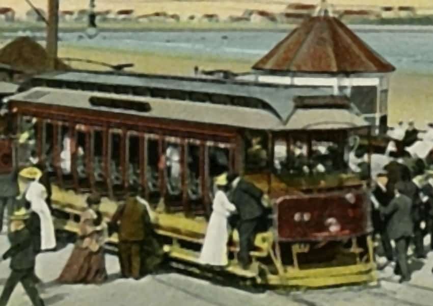 Postcard: Hampton Beach, the boardwalk, bandstand, and beach with people alighting the tram